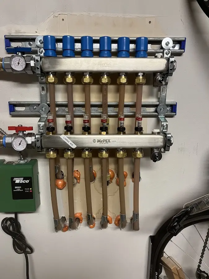 Plumber performing Water Heater Repair at a residential property in Jericho