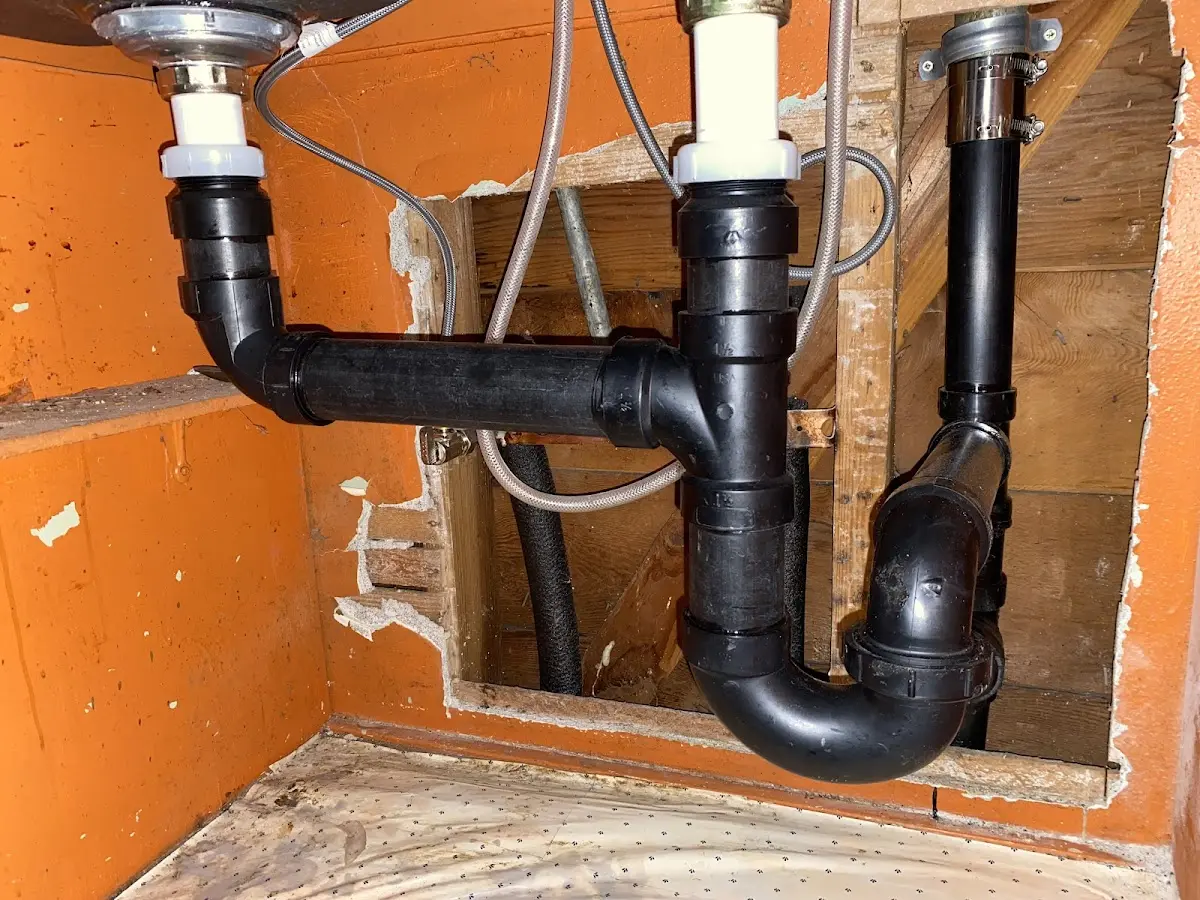 Professional Garbage Disposal Repair equipment and tools on the job in Jericho